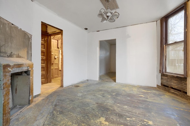 empty room with a notable chandelier