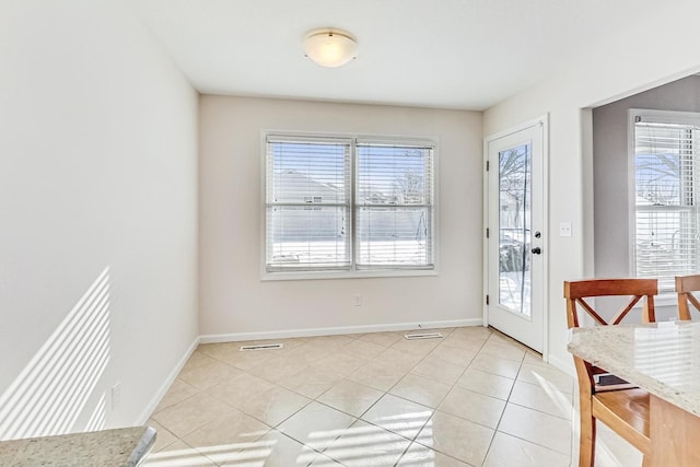 interior space with light tile patterned flooring