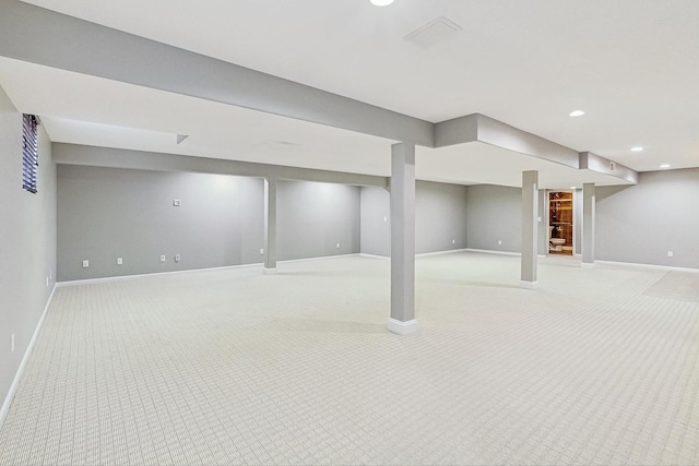 basement featuring light carpet