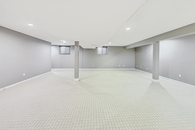 basement featuring light carpet