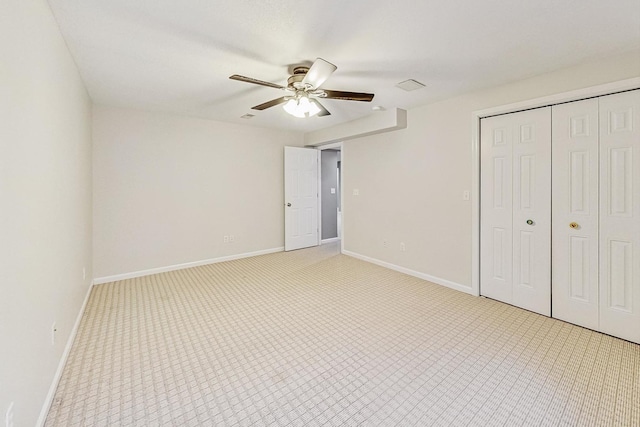 unfurnished bedroom with ceiling fan, a closet, and light colored carpet