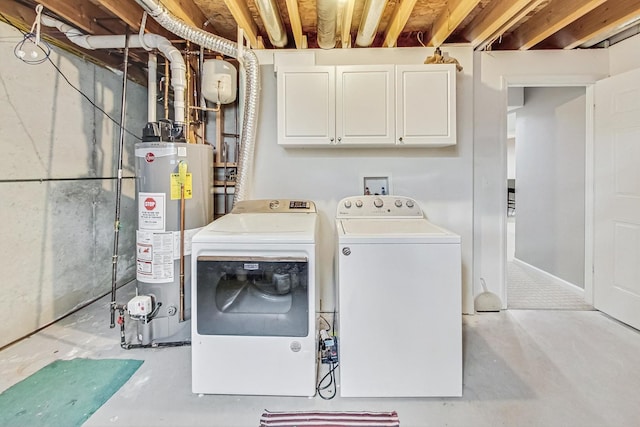 laundry area featuring cabinets, washing machine and dryer, and gas water heater