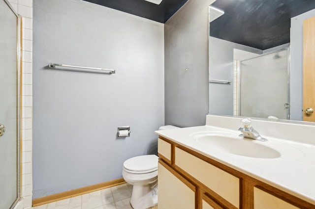 bathroom featuring a shower with shower door, toilet, and vanity