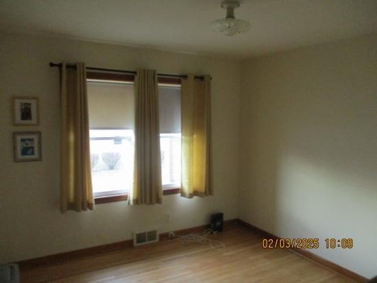 unfurnished room featuring hardwood / wood-style floors