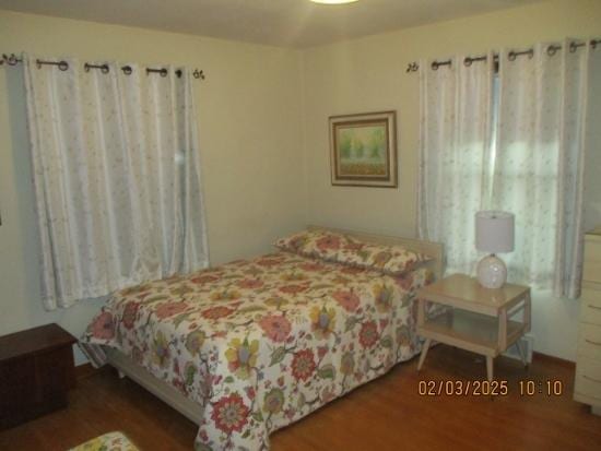 bedroom featuring wood-type flooring