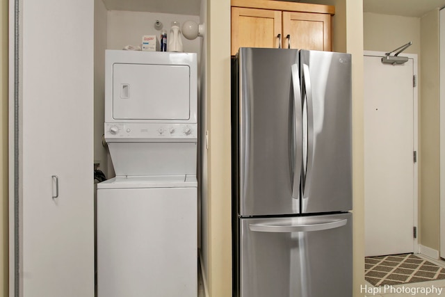 washroom with stacked washer / dryer