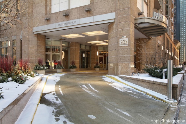 view of snow covered property entrance