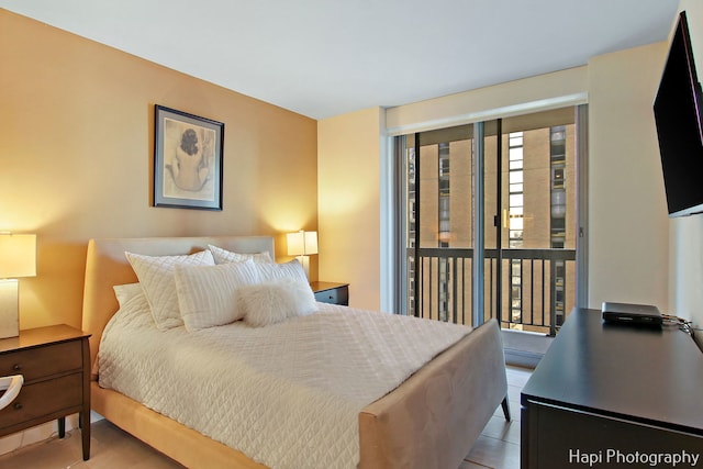 tiled bedroom featuring access to exterior