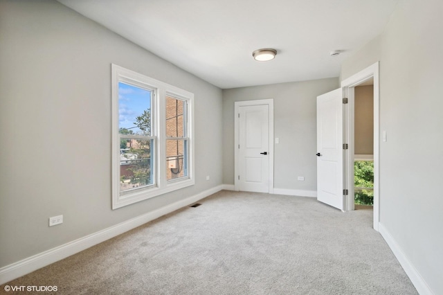 unfurnished bedroom with light carpet