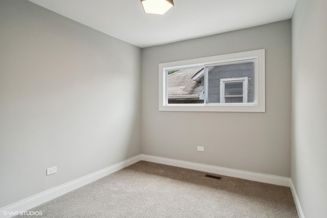 spare room featuring carpet floors