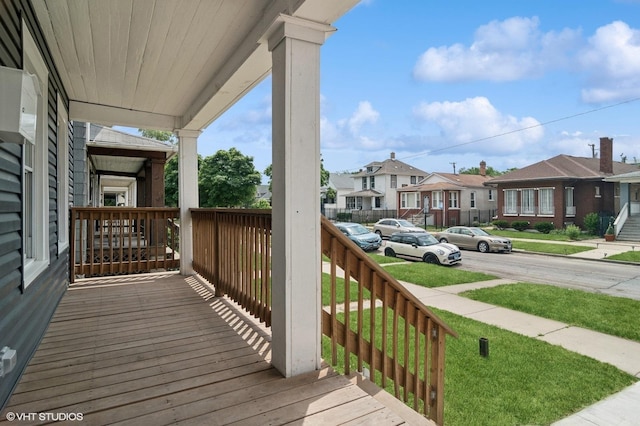 wooden terrace featuring covered porch