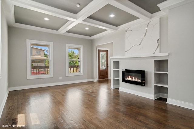 unfurnished living room featuring dark wood-type flooring, crown molding, coffered ceiling, and beamed ceiling