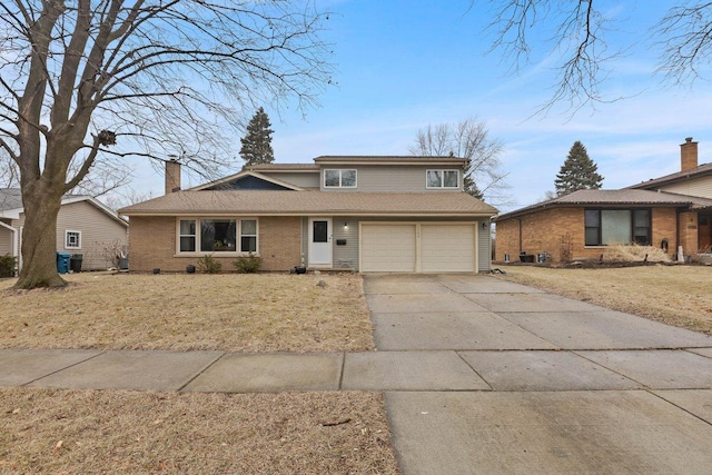 view of front facade featuring a garage and a front lawn