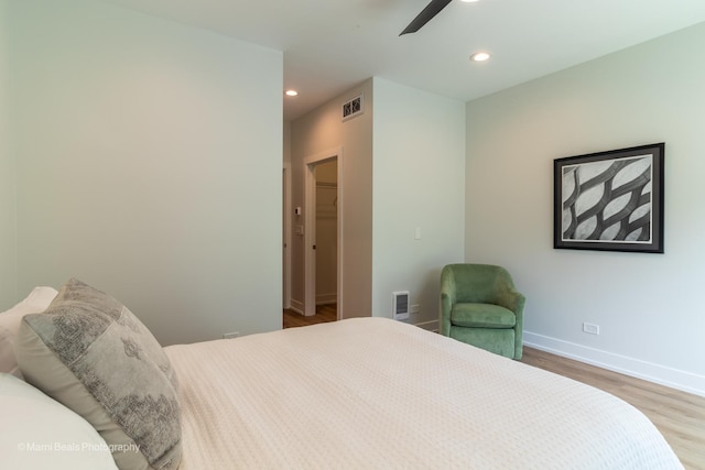 bedroom featuring ceiling fan and wood-type flooring