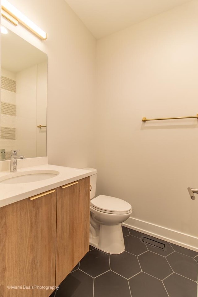 bathroom with toilet and vanity