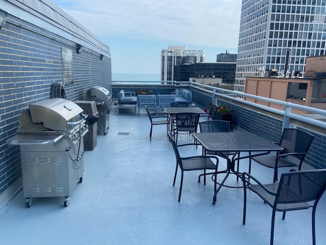 view of patio featuring an outdoor hangout area, a balcony, and a grill