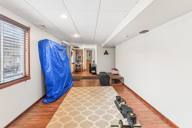 exercise room with hardwood / wood-style flooring