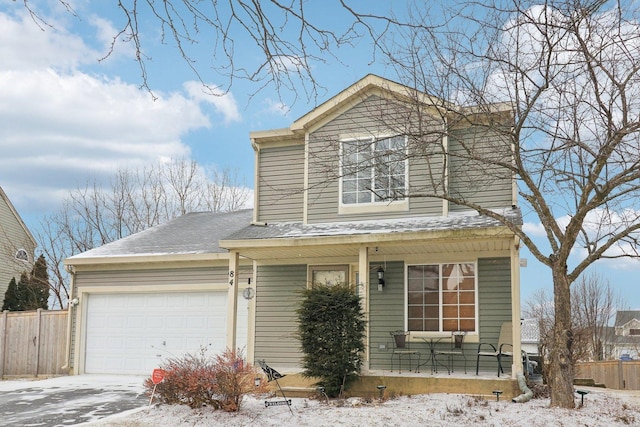 view of front property with a garage and a porch