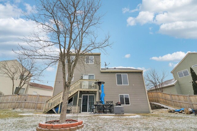 rear view of house with a wooden deck