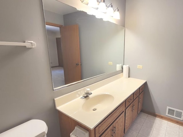 bathroom with tile patterned floors, vanity, and toilet