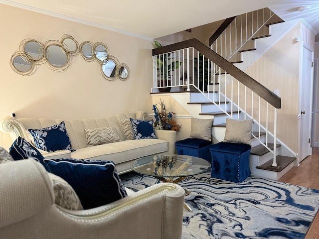 living room with ornamental molding, stairs, and wood finished floors