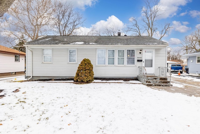 view of snow covered house