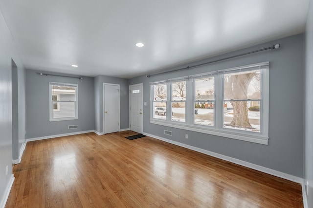 unfurnished room featuring light hardwood / wood-style floors