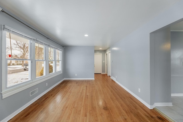 unfurnished room featuring light hardwood / wood-style flooring