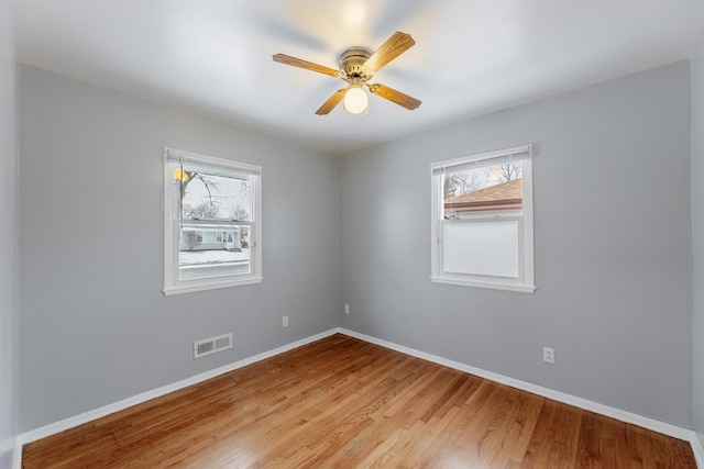 unfurnished room featuring light hardwood / wood-style floors and ceiling fan