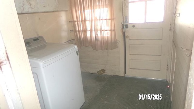 laundry room with a wealth of natural light and washer / clothes dryer