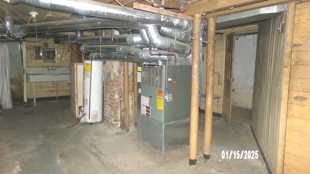 utility room featuring gas water heater