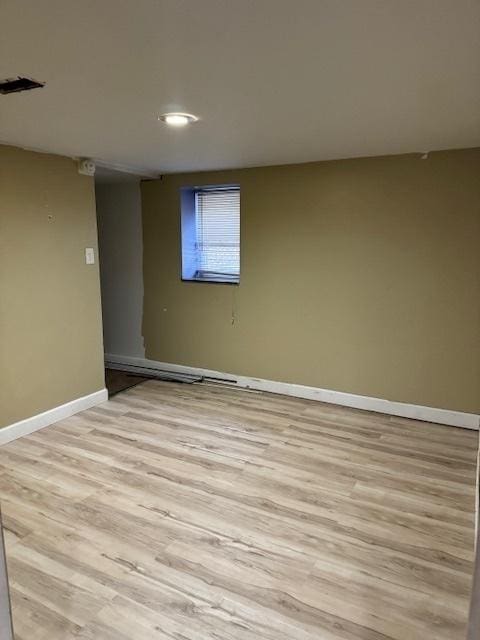 basement featuring light hardwood / wood-style flooring