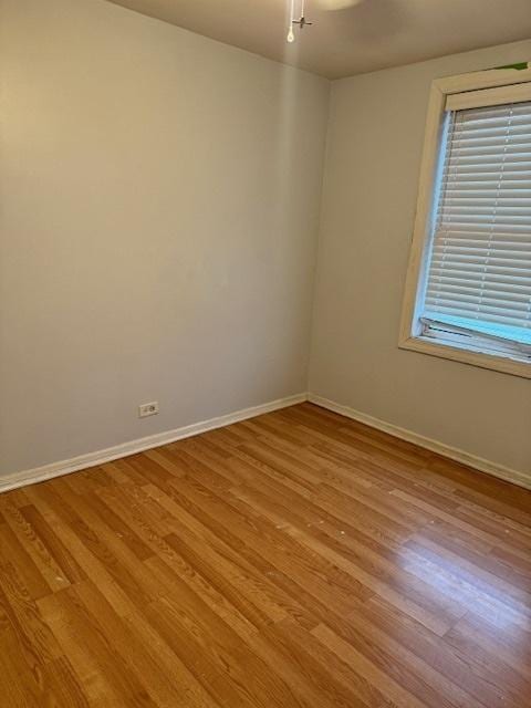 empty room with light hardwood / wood-style floors