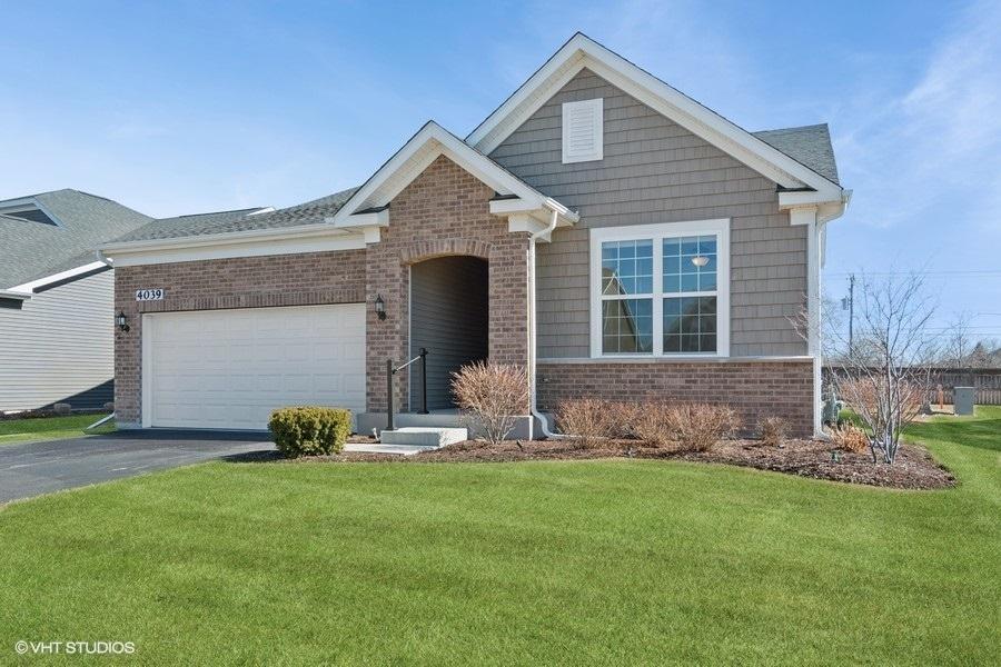 4039 Lobo Ln, Naperville, IL 60564 - craftsman-style house featuring aphalt driveway, brick siding, a garage, and a front lawn