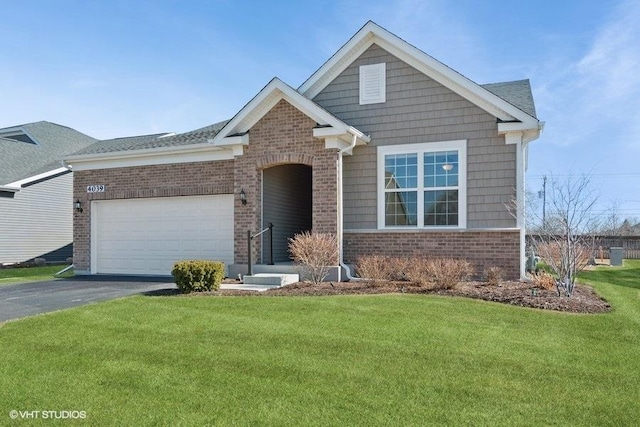 craftsman-style house featuring aphalt driveway, brick siding, a garage, and a front lawn