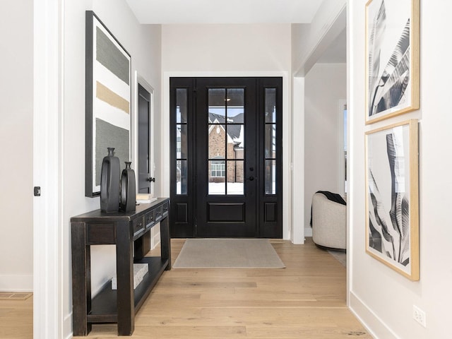 entrance foyer with light hardwood / wood-style flooring