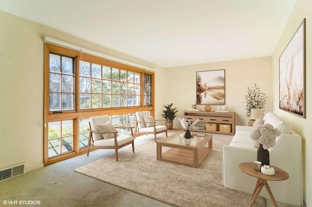 living area with light colored carpet