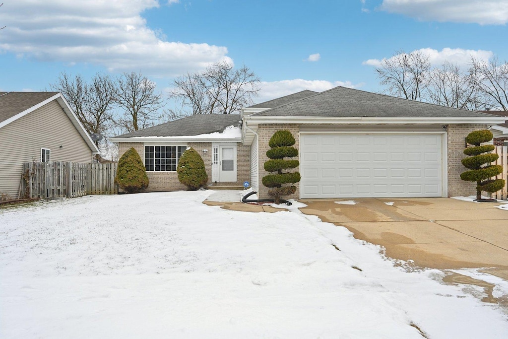 single story home with a garage