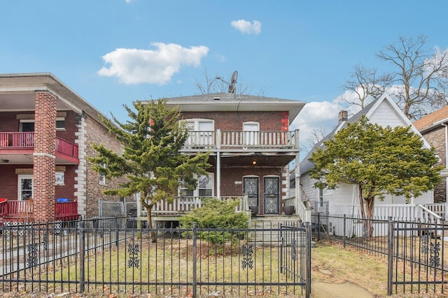 view of front of house featuring a porch and a balcony