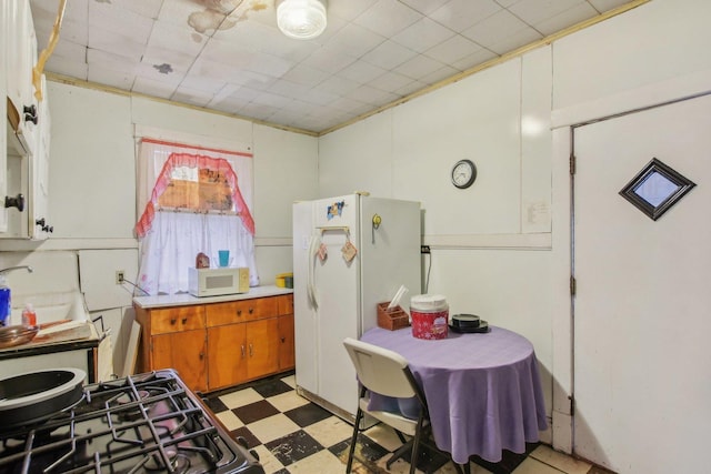 kitchen with white appliances and sink