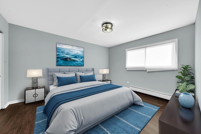 bedroom featuring baseboard heating and dark wood-type flooring