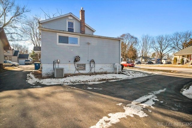 view of side of property with central AC