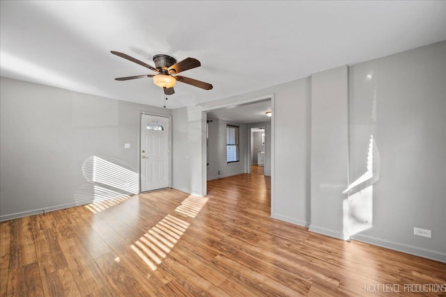 unfurnished room featuring ceiling fan and light hardwood / wood-style flooring