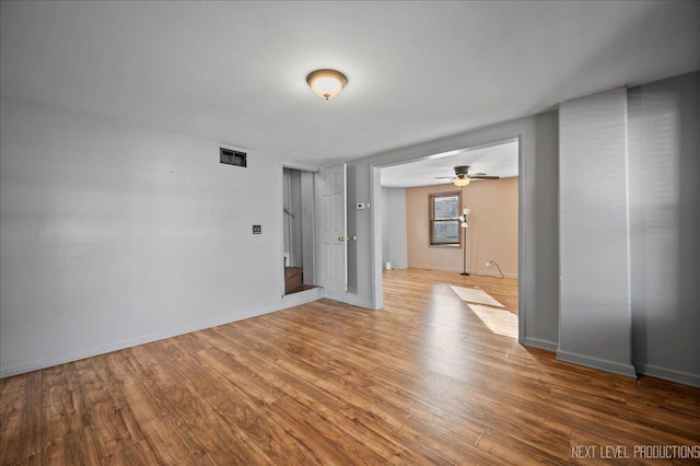 spare room with wood-type flooring