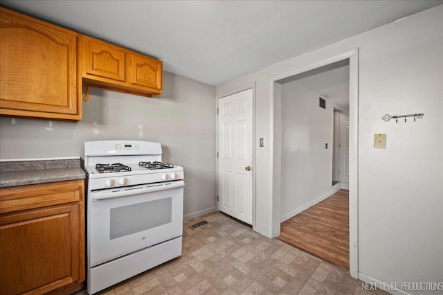 kitchen featuring white gas stove