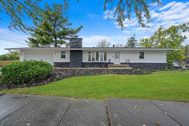 single story home with a garage and a front yard