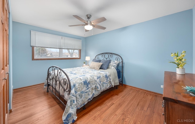 bedroom with ceiling fan and light wood-type flooring