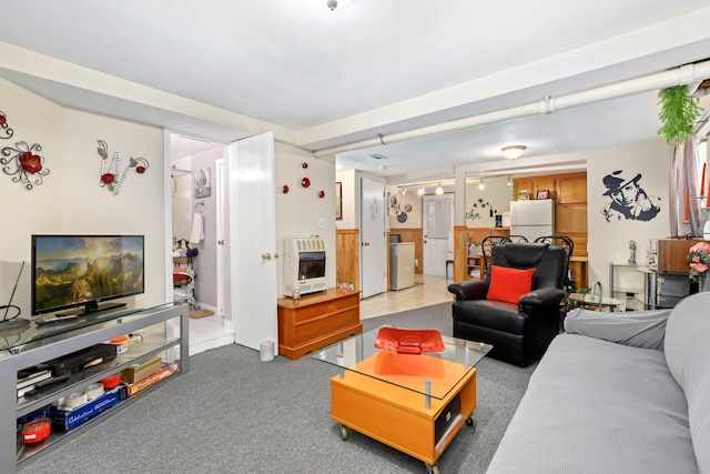 living room with light carpet and heating unit