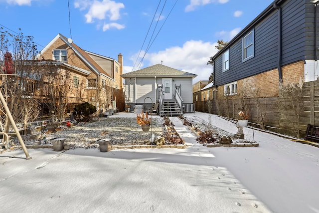 view of snow covered house