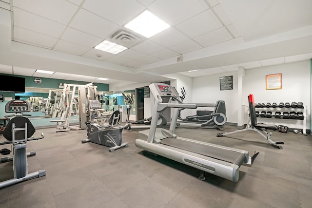 workout area with a paneled ceiling